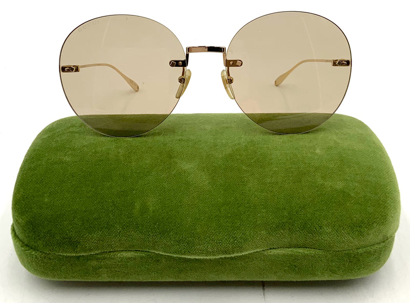 GUCCI Italy Frameless Beige Lens Round Sunglasses
