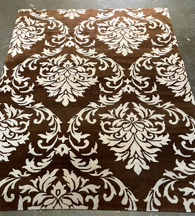 Brown Area Rug with Light Blue Design