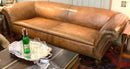 Distressed Leather Roll Arm Sofa with Nailhead Trim