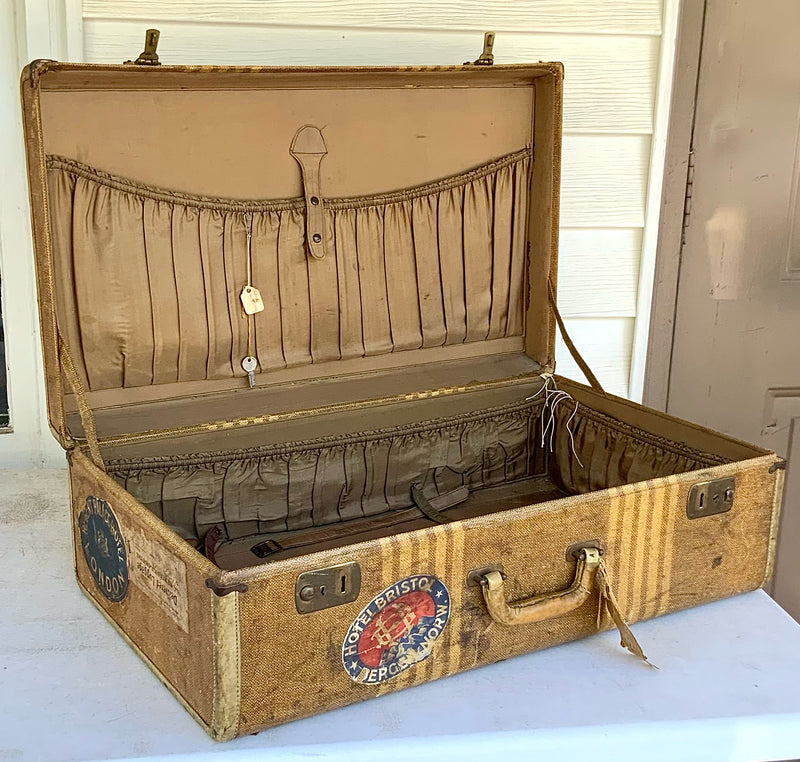 Vintage Suitcase with Travel Stickers