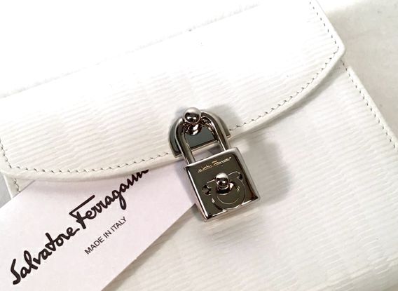 FERRAGAMO White Pebbled Calf Lea Lock Closure French Wallet