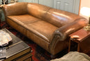 Distressed Leather Roll Arm Sofa with Nailhead Trim