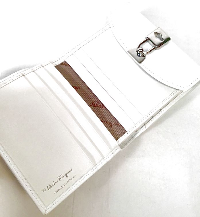 FERRAGAMO White Pebbled Calf Lea Lock Closure French Wallet